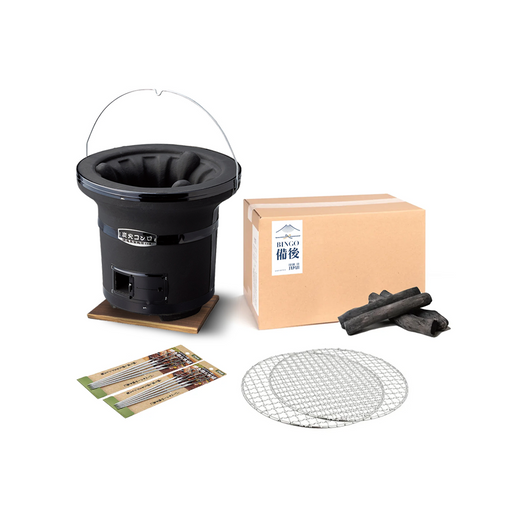 The Mikawa Portable Konro Grill starter set, showing the round black grill on a wooden base, a box of Tosa binchotan charcoal, two grill meshes, and packs of skewers.