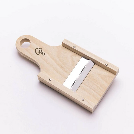A Japanese wooden handheld mandoline slicer with a stainless steel julienne blade, designed for shredding vegetables like daikon and carrots.