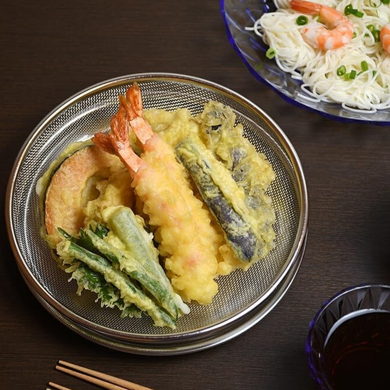 The Ryoumiya strainer and tray set used to serve a delicious portion of assorted tempura for a Japanese meal.

