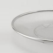 A close-up view of the Ryoumiya strainer's construction, showing the fine stainless steel mesh and sturdy rolled edge.

