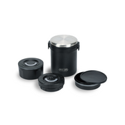 The Pearl Life Home Label Insulated Bento Box in black, showing the outer container, the stainless steel lid, and the three separate black inner containers for rice, soup, and side dishes.