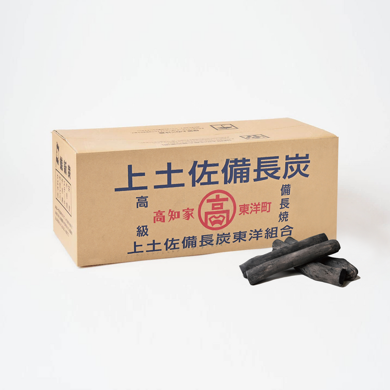 A product image of the 12KG box of Premium Tosa Binchotan, with several pieces of the authentic Japanese white charcoal displayed in front.

