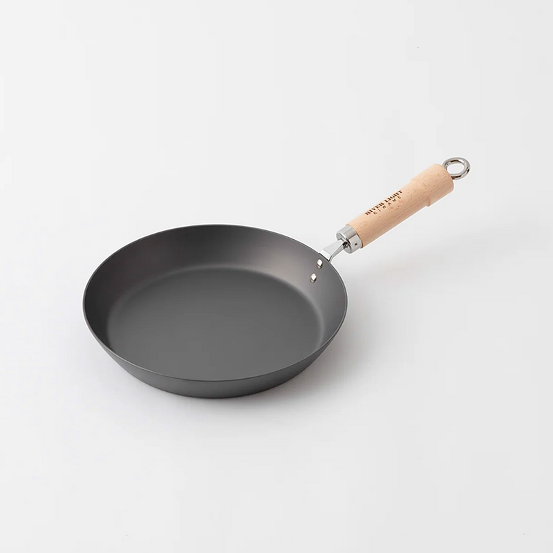 River Light Kiwame 28cm nitrided carbon steel steak pan with a wooden handle, shown on a plain white background.