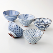 The Saikai Hasami Yaki 5-piece bowl set, showing five bowls with different classic Japanese blue and white patterns, displayed on a white surface.
