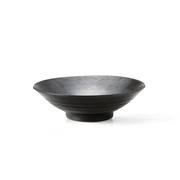 An angled studio shot of the black Seigaiha Ocean Wave ramen bowl, showing the intricate wave pattern on the interior.

