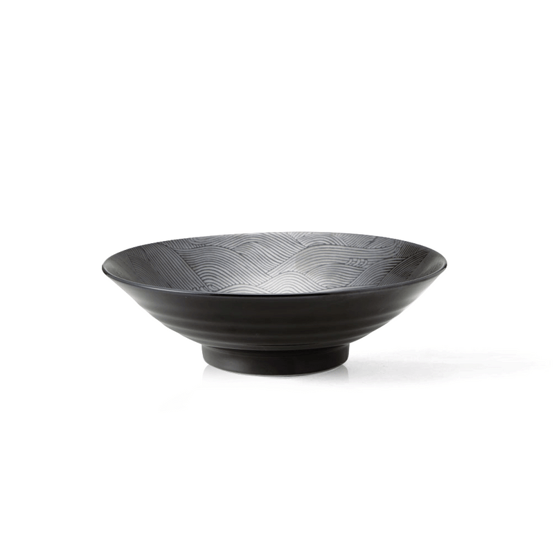 An angled studio shot of the black Seigaiha Ocean Wave ramen bowl, showing the intricate wave pattern on the interior.

