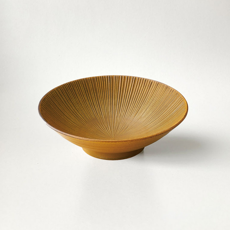 The Sendan Kurawanka Japanese ramen bowl in a glossy mustard yellow finish, featuring fine radiating lines on its interior surface.
