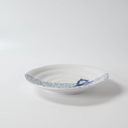 Side angle of the Shichita Mino Yaki Cat Hyouretsumon Pattern Plate showing its slight depth and rim, with the skating cat and geometric design on one side.

