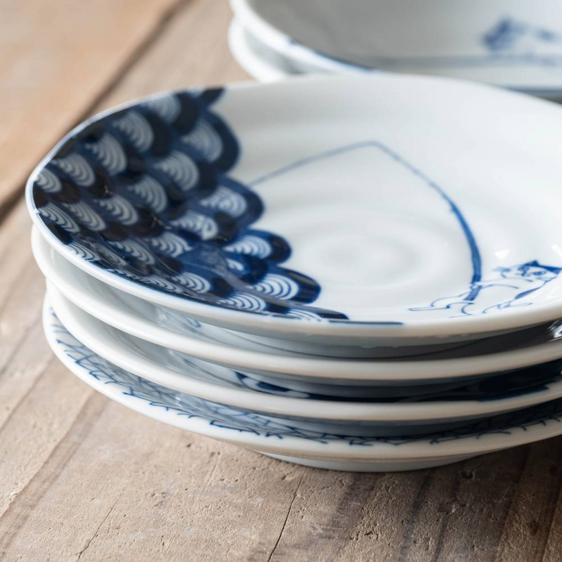 Stacked cat fishing plates highlighting consistency of pattern and form.

