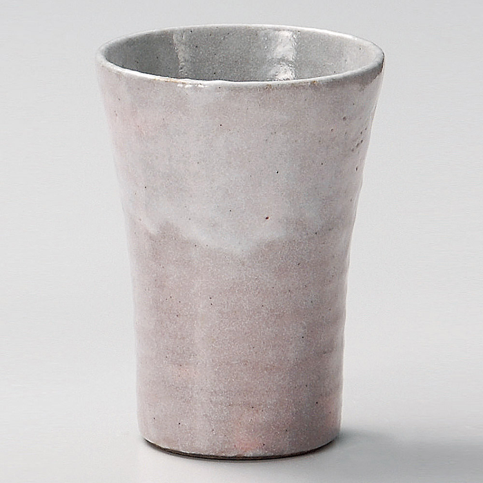 Traditional Shino Yaki cup in a soft pink hue, reflecting Japanese ceramic artistry.