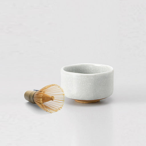 Shiro Kannyu 450ml white crackle-glaze matcha bowl with a bamboo whisk