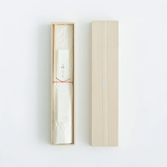 The knife comes in a beautifully crafted wooden box, with the knife and an accompanying paper insert wrapped in delicate white paper tied with a thin red string, offering a traditional and sophisticated presentation.