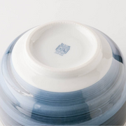 The underside of the Showa Seito bowl, showing the blue maker's mark and 'JAPAN' stamp on the base of the foot.