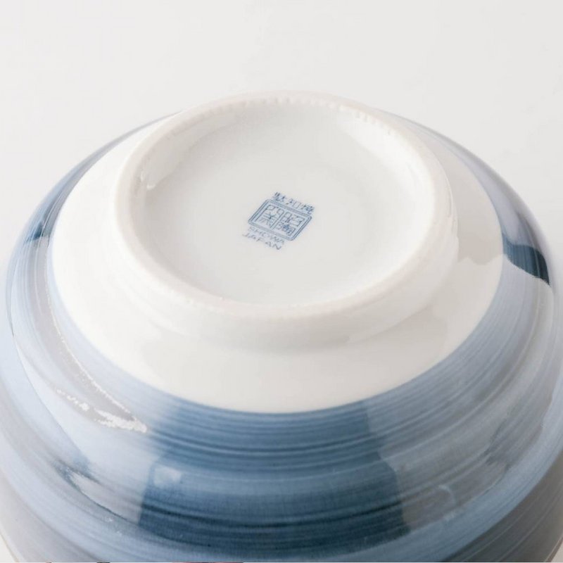 The underside of the Showa Seito bowl, showing the blue maker's mark and 'JAPAN' stamp on the base of the foot.