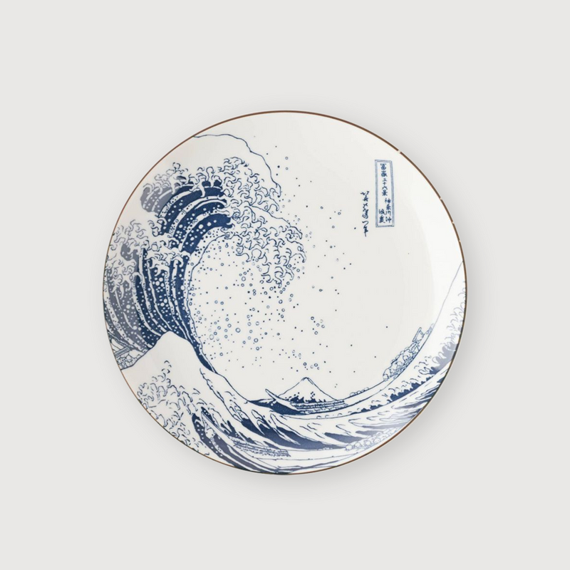 A top-down studio shot of the 25cm Showa Seito 'The Great Wave' dinner plate, showing the complete Hokusai artwork on its surface.

