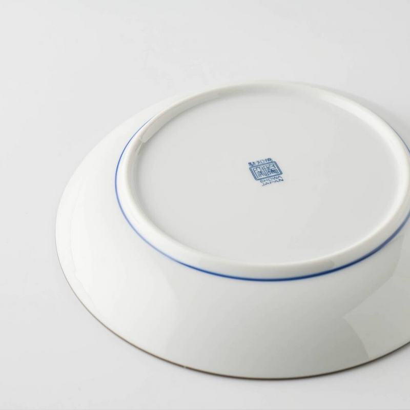 The underside of the Showa Seito plate, showing the blue maker's mark and 'JAPAN' stamp on the base.