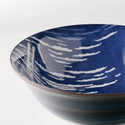 A close-up of the interior rim of the Showa Seito Mount Fuji bowl, highlighting the detailed 'Great Wave' artwork.
