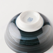 The base of the Showa Seito Mount Fuji bowl, showing the maker's mark and the tall white foot.