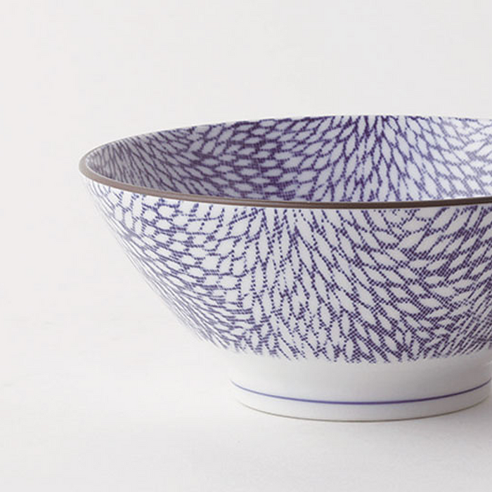 Angled view of the Showa Seito Chrysanthemum Japanese Soba Bowl, 18cm in diameter, adorned with intricate blue chrysanthemum patterns on a white background.