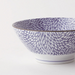 Angled view of the Showa Seito Chrysanthemum Japanese Soba Bowl, 18cm in diameter, adorned with intricate blue chrysanthemum patterns on a white background.
