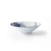 A side-profile studio shot of the Showa Seito 'The Great Wave' Japanese ramen bowl on a white background, showcasing its classic shape and the iconic blue Hokusai artwork within.