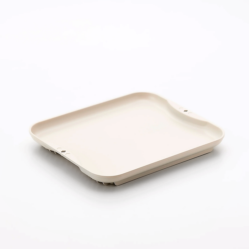A Sugiyama Kinzoku Defrosting Tray in a light cream colour, shown at an angle on a white background.