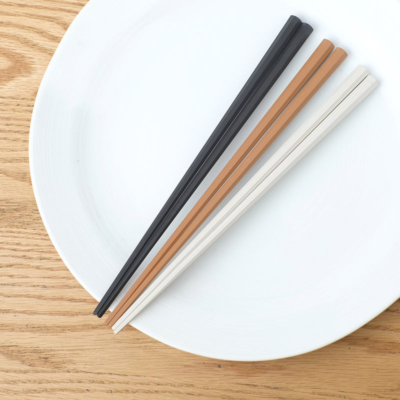 Sunlife Octagonal Chopsticks 23cm, three pairs in charcoal, taupe and white on a plate