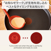 A graphic demonstrating the T-fal Thermo-Signal technology, showing how the heat indicator turns solid red when the crepe pan is ready for batter.

