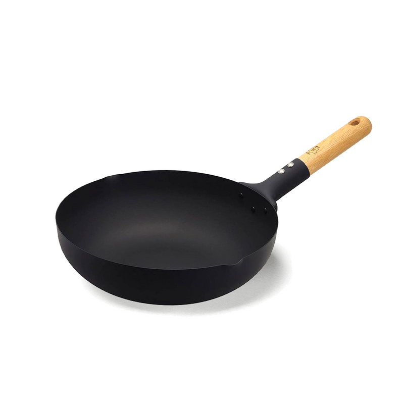 Takumi 28cm carbon steel wok with matte black finish, deep rounded sides, wide stable base, and natural wooden handle.







