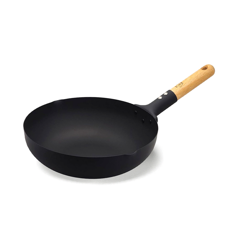 Takumi 30cm carbon steel wok with matte black finish, high rounded sides, wide stable base, ergonomic wooden handle, and pouring lips.







