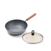 The Tanabe Kanagu 26cm Carbon Steel Wok displayed with its optional matching glass lid.

