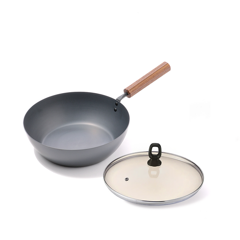 The Tanabe Kanagu 26cm Carbon Steel Wok displayed with its optional matching glass lid.


