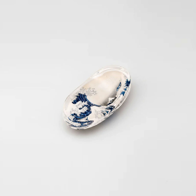 The Great Wave chopstick rest, clear acrylic oval with Hokusai's Great Wave off Kanagawa print sealed inside