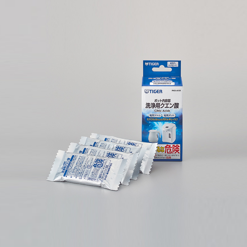 Tiger cleaning agent packets and packaging on a gray background