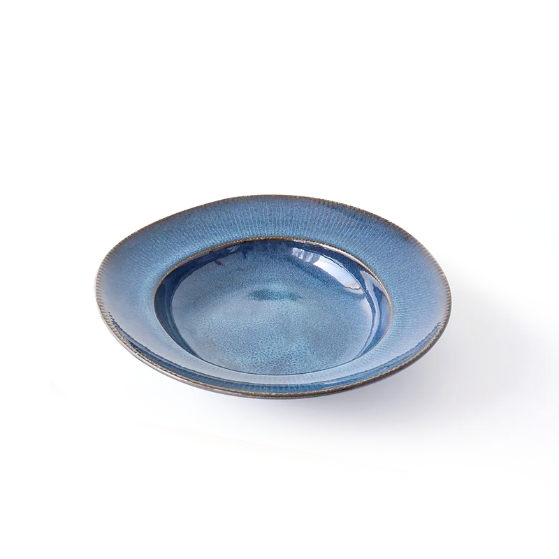 A top-down view of a Tojiki Tonya Orlo Series Pasta Plate, 24cm in diameter, featuring a deep blue hue with a subtle gradient and textured rim.