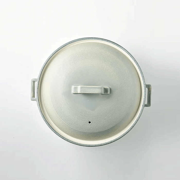 Top view of the silver-grey Tojiki Tonya Tstyle Donabe Japanese clay pot, highlighting its round lid with a handle in the center.