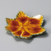12cm plate capturing the intricate details and colors of a fall leaf.