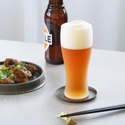 Toyo Sasaki Frosted Beer Glass with Packaging – A frosted beer glass placed beside its minimalist-designed cardboard packaging, which features Japanese text.

