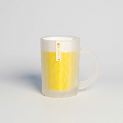 The Toyo Sasaki frosted glass beer mug, featuring a textured surface and sturdy handle, shown with a yellow insert to simulate beer against a light grey background.
