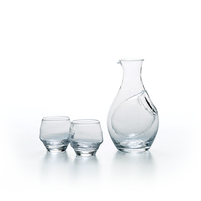 Toyo Sasaki Takasegawa Handmade Sake Set - clear glass carafe and two matching sake glasses displayed on a white background.