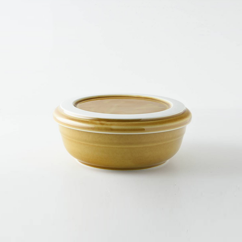 The Tripware Japan Bowl and Plate Set in a warm caramel glaze, with the plate functioning as a lid on the bowl.

