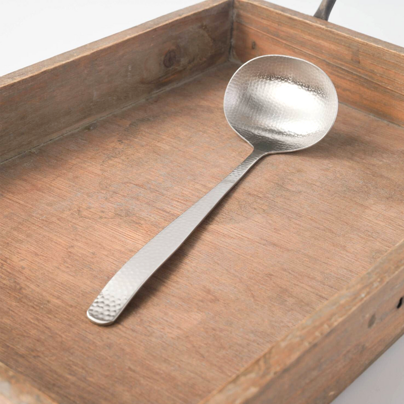 A small 21cm stainless steel soup ladle featuring a traditional Japanese hammered texture, displayed on a wooden tray.