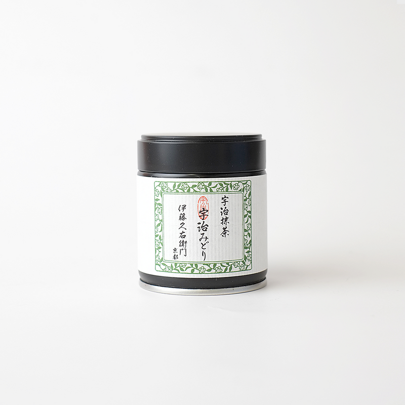 Uji Midori Matcha Powder 20g tin by Itoh Kyuemon, featuring a white label with green floral border and Japanese calligraphy, in a black-lidded metal tin
