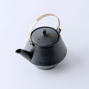 Yamatsu frustum japanese teacup in soft matte pink with geometric contour and handcrafted finish.