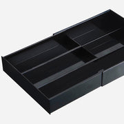 Yamazaki Tower expandable sliding cutlery tray in black, showing the compartment layout