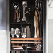 Black Yamazaki Tower cutlery tray extended to fit a wider drawer