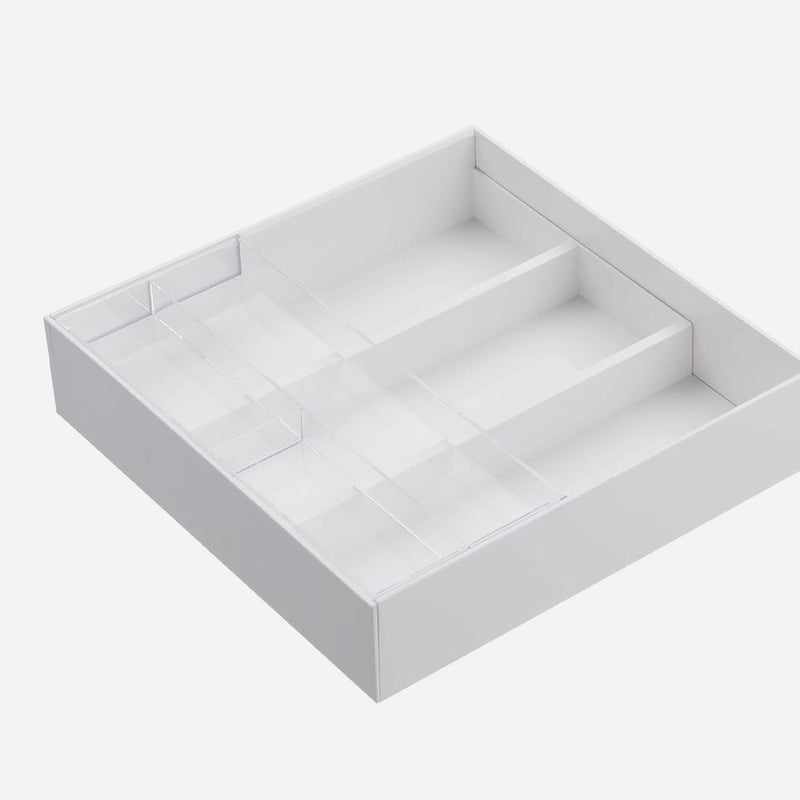 Undivided right pocket of the white Yamazaki Tower cutlery tray holding long kitchen tools