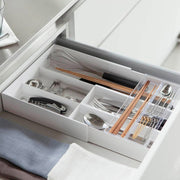 Yamazaki Tower expandable sliding cutlery tray in white, organising cutlery and chopsticks in a kitchen drawer