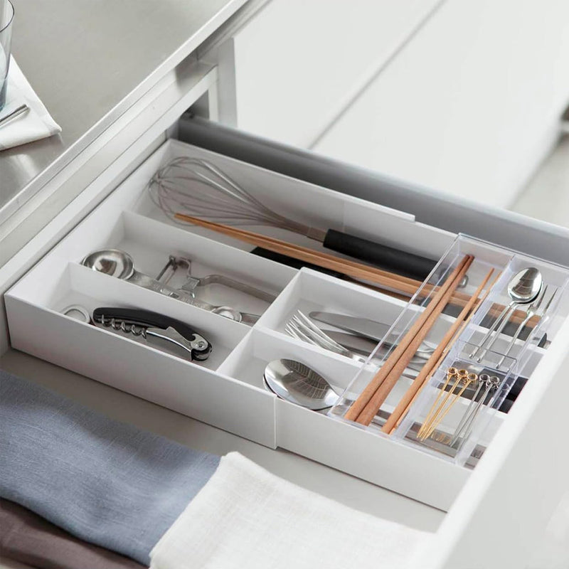 Yamazaki Tower expandable sliding cutlery tray in white, organising cutlery and chopsticks in a kitchen drawer