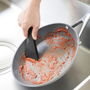 Scraper magnetically attached to different kitchen surfaces in three views.

